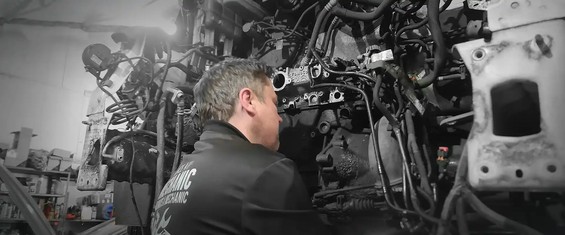 Mechanic performing routine car service in a modern garage in Newbury